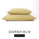 Two luxury dog bed mattresses in a warm golden mustard upholstery fabric stacked on top of each other, with 'CORNFIELD' and a black 'Styled To Order' label on a white background; these machine washable dog bed mattresses are made for lasting comfort and easy care.