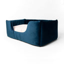 The Deeply Dishy Dog Bed  by Charley Chau in dark blue velvet with high-sides and a deep-filled luxury dog bed mattress in pale pink.