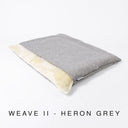 Luxury dog burrow bag by designers Charley Chau in a grey woven upholstery fabric with a cream plush lining on a white background with text "Weave II - Heron Grey".