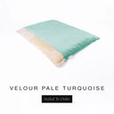 A luxurious Dog Burrow Bag, a sleeping bag style dog bed or snuggle sack style dog bed, with an outer cover in pale turquoise blue upholstery-quality Velour with a plush, cream faux-fur lining, and a badge with the colour name Pale Turquoise on a white background.