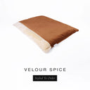 A luxurious Dog Burrow Bag, a sleeping bag style dog bed or snuggle sack style dog bed, with an outer cover in burnt orange upholstery-quality Velour with a plush, cream faux-fur lining, and a badge with the colour name Spice on a white background.