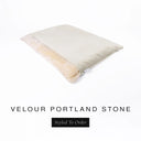 A luxurious Dog Burrow Bag, a sleeping bag style dog bed or snuggle sack style dog bed, with an outer cover in pale stone grey upholstery-quality Velour with a plush, cream faux-fur lining, and a badge with the colour name Portland Stone on a white background.