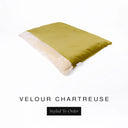 A luxurious Dog Burrow Bag, a sleeping bag style dog bed or snuggle sack style dog bed, with an outer cover in chartreuse upholstery-quality Velour with a plush, cream faux-fur lining, and a badge with the colour name Chartreuse on a white background.