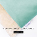 Close up of the corner of bespoke Dog Burrow Bag with a pale turquoise velvet outer cover and plush cream faux-fur lining witht he Charley Chau brand label visibale on a white backdrop.