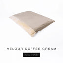 A luxurious Dog Burrow Bag, a sleeping bag style dog bed or snuggle sack style dog bed, with an outer cover in beige upholstery-quality Velour with a plush, cream faux-fur lining, and a badge with the colour name Coffee Cream on a white background.
