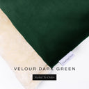 A close up detail of the corner of a Charley Chau Burrow Bag Dog Bed with dark green outer cover in upholstery-quality Velour and plush cream faux-fur lining with a woven brand label showing the Charley Chau logo on a white backdrop.