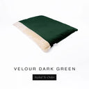 A luxurious Dog Burrow Bag, a sleeping bag style dog bed or snuggle sack style dog bed, with an outer cover in dark green upholstery-quality Velour with a plush, cream faux-fur lining, and a badge with the colour name Dark Green on a white background.