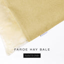 A close up detail of the corner of a Charley Chau Burrow Bag Dog Bed with warm straw yellow outer cover in woven wool texture upholstery fabric Faroe and plush cream faux-fur lining with a woven brand label showing the Charley Chau logo on a white backdrop.