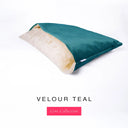 Charley Chau's luxury Dog Snuggle Bed, a cave bed style dog bed or burrow bed, with an outer cover in deep teal upholstery-quality Velour with a plush, cream faux-fur lining, on a white background.
