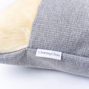close up shot of the grey woven upholstery fabric of a Charley Chau Dog Snuggle Bed 