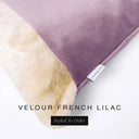 Close up of the corner of a luxury Dog Snuggle Bed, a cave bed style dog bed or sleeping bag style dog bed, with a mid purple upholstery-quality velour / velvet outer cover and plush cream faux-fur lining, showing a Charley Chau designer brand label on the dog bed, on a white background.
