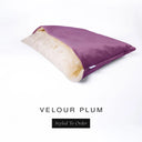 A luxury Dog Snuggle Bed, a cave bed style dog bed or sleeping bag dog bed, in upholstery-quality deep plum purple Velour with a cream plush lining on a white backdrop.