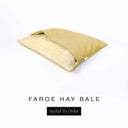 A Charley Chau Snuggle Bed, a cave bed or sleeping bag style dog bed made with a yellow woven upholstery-quality fabric with cream, plush, faux-fur lining on a white backdrop.