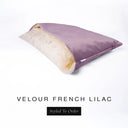 A luxury Dog Snuggle Bed, a cave bed style dog bed or sleeping bag dog bed, in upholstery-quality mid purple  Velour with a cream plush lining on a white backdrop.