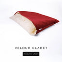 A luxury Dog Snuggle Bed, a cave bed style dog bed or sleeping bag dog bed, in upholstery-quality red Velour with a cream plush lining on a white backdrop.