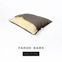 A Charley Chau Snuggle Bed, a cave bed or sleeping bag style dog bed made with a daark brown woven upholstery-quality fabric with cream, plush, faux-fur lining on a white backdrop.