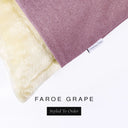 Corner detail of a luxury Dog Snuggle Bed, a sleeping bag style dog bed or cave bed style dog bed, with light-purple colored upholstery quality outer cover and plush cream faux-fur lining with Charley Chau's designer brand label.