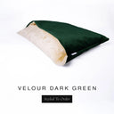 A luxury Dog Snuggle Bed, a cave bed style dog bed or sleeping bag dog bed, in upholstery-quality dark green Velour with a cream plush lining on a white backdrop.