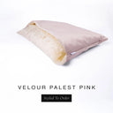 A luxury Dog Snuggle Bed, a cave bed style dog bed or sleeping bag dog bed, in upholstery-quality palest pink Velour with a cream plush lining on a white backdrop.