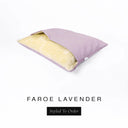 A Charley Chau Snuggle Bed, a cave bed or sleeping bag style dog bed made with a lavender purple woven upholstery-quality fabric with cream, plush, faux-fur lining on a white backdrop.