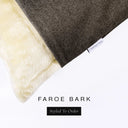 Corner detail of a luxury Dog Snuggle Bed, a sleeping bag style dog bed or cave bed style dog bed, with dark brown colored upholstery quality outer cover and plush cream faux-fur lining with Charley Chau's designer brand label.