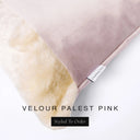 Close up of the corner of a luxury Dog Snuggle Bed, a cave bed style dog bed or sleeping bag style dog bed, with a palest pink upholstery-quality velour / velvet outer cover and plush cream faux-fur lining, showing a Charley Chau designer brand label on the dog bed, on a white background.
