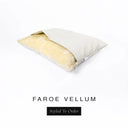 A Charley Chau Snuggle Bed, a cave bed or sleeping bag style dog bed made with a pale beige woven upholstery-quality fabric with cream, plush, faux-fur lining on a white backdrop.