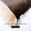 Close up of the corner of a luxury Dog Snuggle Bed, a cave bed style dog bed or sleeping bag style dog bed, with a rich brown upholstery-quality velour / velvet outer cover and plush cream faux-fur lining, showing a Charley Chau designer brand label on the dog bed, on a white background.