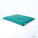 Luxury dog travel pad mattress in jade green on a white backdrop. 