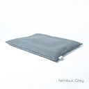 Luxury dog travel pad mattress in grey  on a white backdrop. 