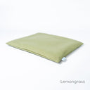 Luxury dog travel pad mattress in pale green on a white backdrop. 