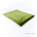 Luxury dog travel pad in velvet - by designers Charley Chau in green velour with a contrast green piped edge on a white backdrop.