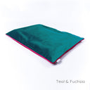 Luxury slimline dog travel pad in velvet - by designers Charley Chau - in teal velour with a contrast fichsia pink piped edge on a white backdrop.