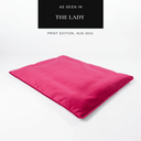Hot pink velvet luxury dog travel bed mattress on a white backdrop with a "As seen in The Lady" press feature badge.