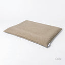 Luxury Dog Travel Bed Mattress in beige woven upholstery fabric on a white backdrop.