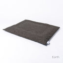 Luxury Dog Travel Pad Mattress, a slimline travel dog bed, in durable dark brown woven upholstery fabric on a white backdrop.