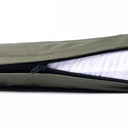 Close-up of a zip opening on a tough, water-resistant Dry Wax Cotton Canvas travel dog bed, revealing the white inner lining.