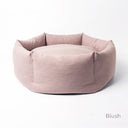 Pink, luxury donut dog bed that is machine washable and made to last.