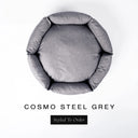 A top-down view of a cool steel grey luxury donut dog bed with high-wall padded sides and a round mattress inside, on a white background with the text 'COSMO STEEL GREY' and a black 'Styled To Order' label below.