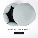 A luxury donut dog bed in pale sea-mist grey-green Cosmo fabric seen from above with the round mattress lifted out of the high-wall donut bed sides, on a white background with the text 'COSMO SEA MIST' and a black 'Styled To Order' label.
