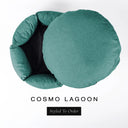 A luxury donut dog bed in deep teal green Cosmo fabric seen from above with the round mattress lifted out of the high-wall donut bed sides, on a white background with the text 'COSMO LAGOON' and a black 'Styled To Order' label.
