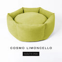 A luxury donut dog bed in zesty lime yellow Cosmo fabric, suitable for all breeds of dogs, with cosy high-wall sides and a deep-filled luxury mattress inside, on a white background with the text 'COSMO LIMONCELLO' and 'Styled To Order' below.