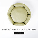 A top-down view of a pale lime yellow luxury donut dog bed with high-wall padded sides and a round mattress inside, on a white background with the text 'COSMO PALE LIME YELLOW' and a black 'Styled To Order' label below.