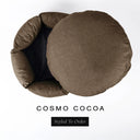 A luxury donut dog bed in warm cocoa brown Cosmo fabric seen from above with the round mattress lifted out of the high-wall donut bed sides, on a white background with the text 'COSMO COCOA' and a black 'Styled To Order' label.