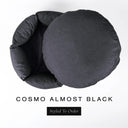 A luxury donut dog bed in charcoal black Cosmo fabric seen from above with the round mattress lifted out of the high-wall donut bed sides, on a white background with the text 'COSMO ALMOST BLACK' and a black 'Styled To Order' label.