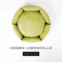 A top-down view of a zesty lime yellow luxury donut dog bed with high-wall padded sides and a round mattress inside, on a white background with the text 'COSMO LIMONCELLO' and a black 'Styled To Order' label below.
