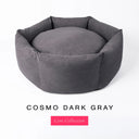 A dark gray premium donut style dog bed, suitable for all breeds of dogs, with cosy high-wall dog bed sides and a deepfilled luxury mattress inside, on a white background with the text 'COSMO DARK GRAY' and 'Core Collection' below.