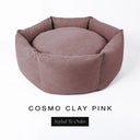 A luxury donut dog bed in dusty clay pink Cosmo fabric, suitable for all breeds of dogs, with cosy high-wall sides and a deep-filled luxury mattress inside, on a white background with the text 'COSMO CLAY PINK' and 'Styled To Order' below.