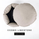 A luxury donut dog bed in pale limestone grey Cosmo fabric seen from above with the round mattress lifted out of the high-wall donut bed sides, on a white background with the text 'COSMO LIMESTONE' and a black 'Styled To Order' label.