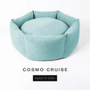 A luxury donut dog bed in pale seafoam blue Cosmo fabric, suitable for all breeds of dogs, with cosy high-wall sides and a deep-filled luxury mattress inside, on a white background with the text 'COSMO CRUISE' and 'Styled To Order' below.